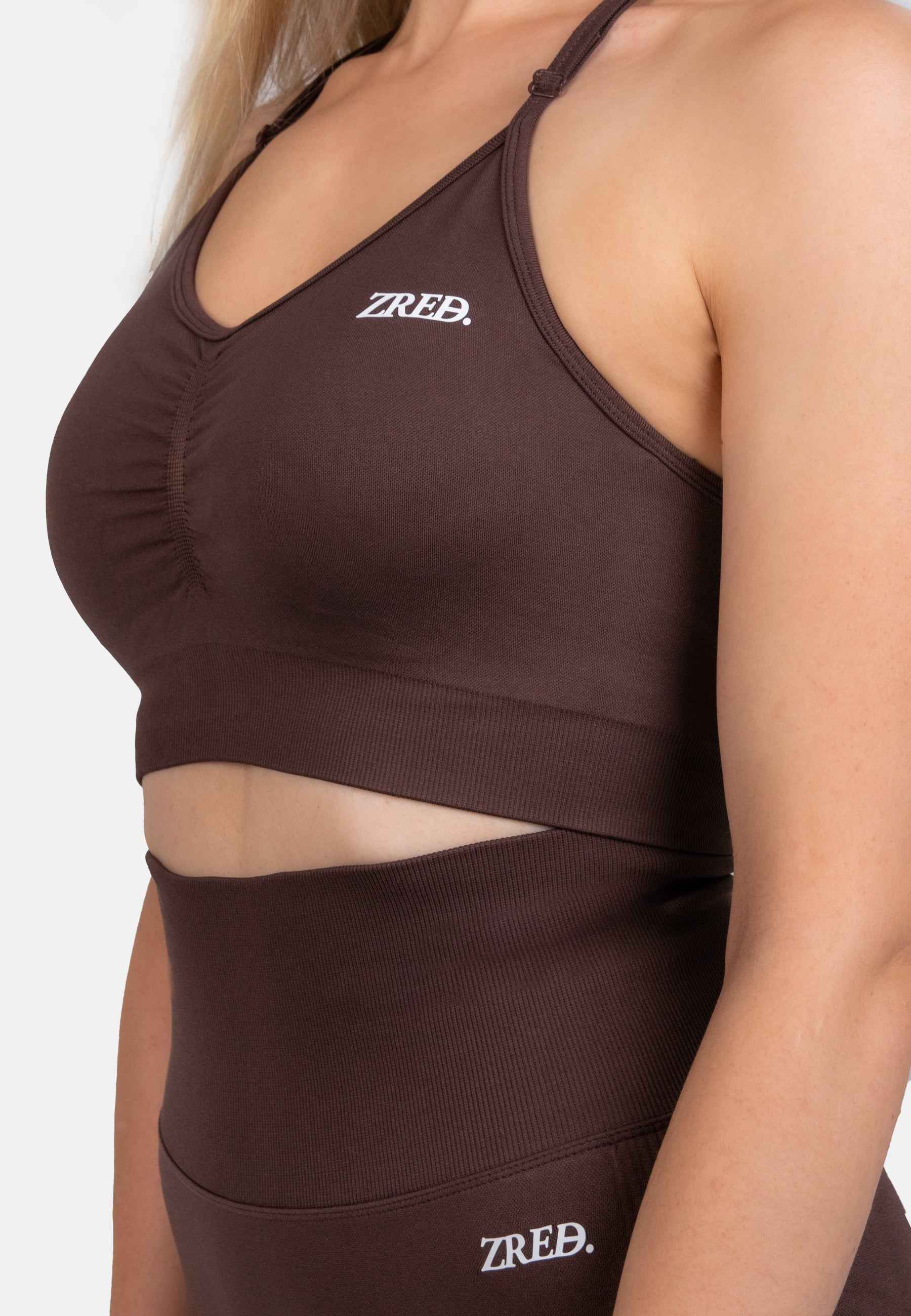 Shape Seamless Sports Bra in chocolate brown with removable pads and adjustable straps for gym and everyday wear.